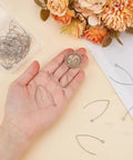 Hand holding Stainless Steel Drop Earring Hooks Set 40 Pieces Silver Long Marquise V Shaped Findings with Ear Nuts