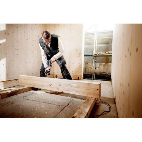 Person using Beast 1300W Hammer Drill With Impulse Mode For Damaged Screw Removal in wooden frame construction.