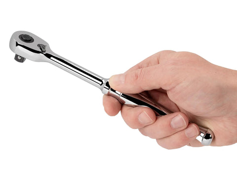 Hand holding Go To Three Eighths Inch Drive Quick Release Ratchet With Eight Inch Length And Ninety Tooth Gear For A Tight Four Degree Swing Arc Ultra Compact Head Design For Confined Spaces And Smooth Rugged Operation.