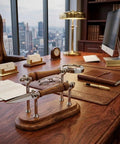 Sleek Silver Brown Wood Desk Set With Magnifying Glass And Letter Opener For Home Office Decor And Boss Level Gift Modern Executive Office Accessories on a wooden desk with skyline view