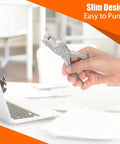 Person holding Six Pack Single Hole Puncher Set In Shiny Silver, 8 Sheet Capacity Each, One Quarter Inch Circle Paper Punch For Crafts And School