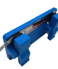 Super Grippy LED Strip Soldering Jig Helper Dual Clamp PCB Hold Down Tool securely holding LED tape strips in blue.