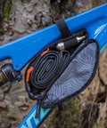 Outpost Corner Bike Bag with Built In Pockets For Gear No Seatpost Rattle Slim Frame Organizer open showing tools and inner lining