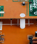 Top Shelf M4 X 12mm Nylon Slotted Set Screws securing electronic components on a circuit board, non-conductive fasteners.