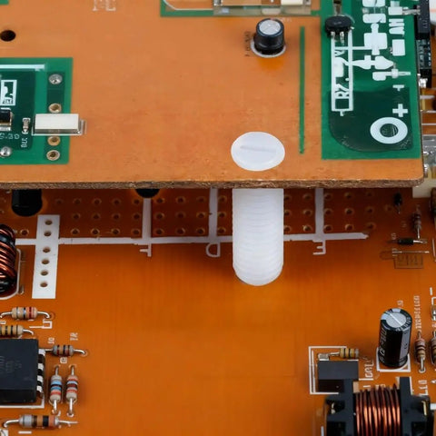 Top Shelf M4 X 12mm Nylon Slotted Set Screws securing electronic components on a circuit board, non-conductive fasteners.