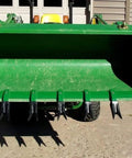 Front view of Bucket Tooth Bar for Sub-Compact Tractors 57 Inch Green Fits Bucket Edges 1/2 Inch or Less No Drilling Required