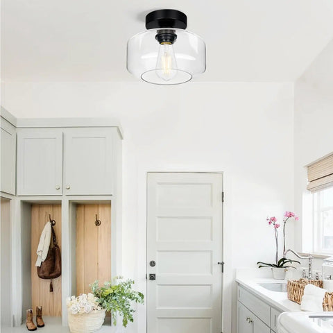 Industrial Dope Semi Flush Mount Ceiling Light in matte black with clear glass shade in a bright modern hallway setting.