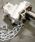 Close-up of a silver gear mechanism and chain, component of Beast Workhorse 3 Point Hitch Backhoe For Tractors With 9 ft Digging Depth 180° Swing