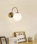 Gold Wall Sconce Mid Century Modern Wall Mount Light Hardwired Sconces Wall Light with Milky White Glass Shade indoor bedside lamp on wall.
