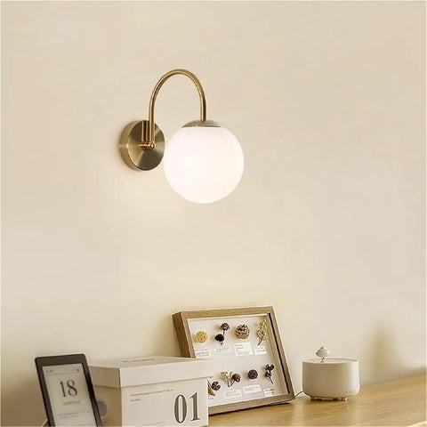 Gold Wall Sconce Mid Century Modern Wall Mount Light Hardwired Sconces Wall Light with Milky White Glass Shade indoor bedside lamp on wall.