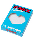 Box packaging of 1/8 inch riser pads for scooters and bikes, featuring "Krux Risers" branding and visible product through the cut-out window.