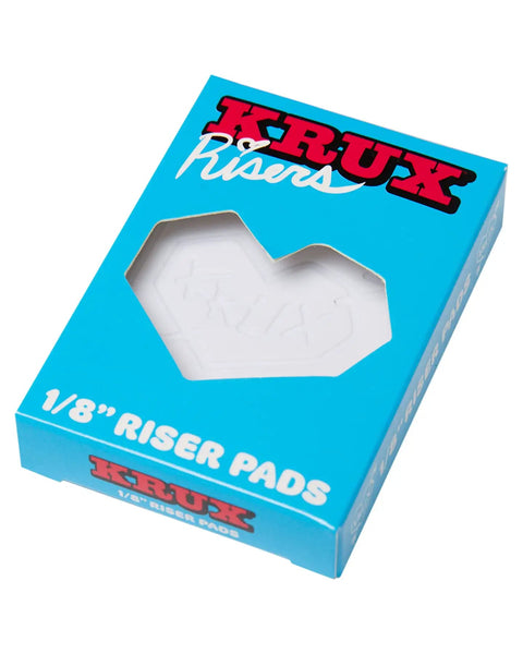 Box packaging of 1/8 inch riser pads for scooters and bikes, featuring "Krux Risers" branding and visible product through the cut-out window.