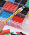Close-up of a yellow wrapped connector from Heat Shrink Tubing Kit With 11 Sizes And 2 To 1 Shrink Ratio 580 Pcs In 6 Colors