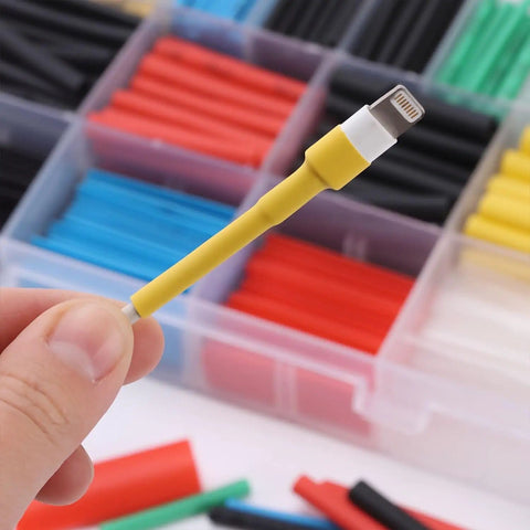 Close-up of a yellow wrapped connector from Heat Shrink Tubing Kit With 11 Sizes And 2 To 1 Shrink Ratio 580 Pcs In 6 Colors