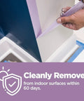 Person removing Delicate Surface Painter’s Tape With Edge Lock Technology For Sharp Lines 1 Inch By 60 Yards Pack Of 4 from wall