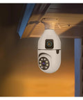 Top Shelf Dual Lens Bulb Wifi Security Camera With Zero Hassle Setup For Indoor Spaces Featuring Ai Human Tracking 360 Degree Pan 180 Degree Tilt Night Vision Plus Two Way Audio mounted on ceiling.