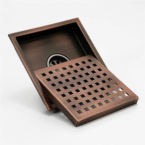 Heavy Duty Six Inch Square Shower Drain Crafted From Brushed Stainless Steel Featuring A Removable Hair Catcher Grate To Beat Clogs Keep Your Bathroom Floor Totally Legit Fresh And Look Damn Sick Daily in a bronze finish.