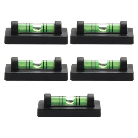 Small for spirit Level with Magnetic Bottom for Cross Stitch Frame, five mini bubble levels on black bases arranged neatly.
