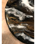 Close-up of 9.5 Inch Resin Marble Lazy Susan With Smooth 360 Degree Rotation For Kitchen Countertop And Dining Table Slick Black Gold White Organizer For Skincare Bath And Home Decor showing black, gold, and white swirls.