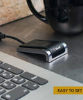 Fast USB Fingerprint Reader For Windows Hello And Passkey Login No Fuss Biometric Security For Your PC With Aluminum Finish In Black And Silver Works With Password Managers And Microsoft Services next to a laptop.