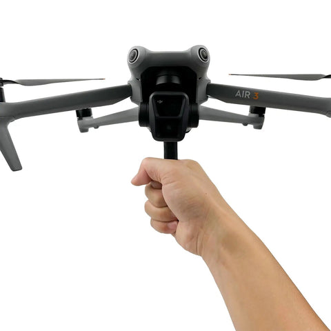 Hand holding Drone Handheld Stabilizer And Lens Bracket Mount For Air 3S Dope One Shot Cinematic Takeoff And Landing.