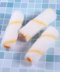 Thirty Mini Paint Roller Sleeves High Density Cotton Refills For Tight Corners Baseboard Trim on a blue grid surface.