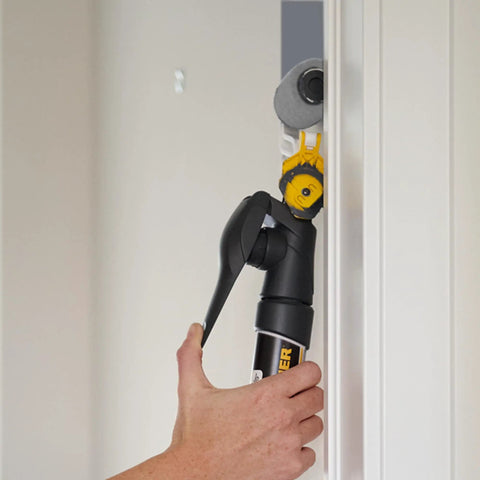 Smart Edge 3 Inch Mini Paint Roller Kit with No Tray Design used on doorframe for clean edge trim, paint held in handle