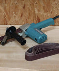 1-1/8 Inch By 21 Inch Belt Sander With Narrow Belt And Exposed Front Pulley For Tight Spaces, shown on workbench