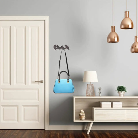 Heavy Duty Cast Iron Wall Mounted Coat Rack For Home Entryway Upgrade Featuring Knockout Build And Modern Vibes To Hang Up Your Gear Without Breaking A Sweat with a blue handbag.