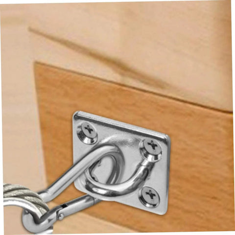 Two Pack Heavy Duty Stainless Steel Ceiling Hooks With Durable Anchor Plates For Hammocks And Yoga Swings Ideal For Home Gyms Studios And Patios Versatile Eye Hooks For Secure Hanging And Rigging Applications In Indoor And Outdoor Setups installed on wood surface