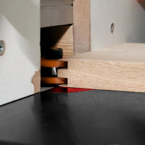 Beefed Up Aluminum Router Lift Kit With Bulletproof Precision Dynamic Insert Plate Compatible With Standard Table Saws For Weekend Warriors And Custom Carpentry Pros Black, close-up of wood being routed on table saw.