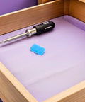 Drawer with Blue Rubber Drawer End Stoppers 20 Piece Set No More Drawer Slams For Silent Glide And Safety next to screwdriver