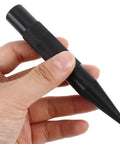 Close-up of black scratch pen from Tough As Nails Auto Body Hammer And Car Dent Repair Pen for quick panel fixes.