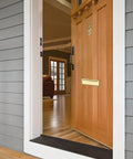 Solid Brass Mail Slot With Interior Back Plate 13 In By 3.625 In Polished Brass Finish 1 Pack installed on wooden door