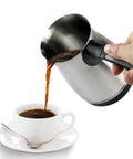 Pouring coffee from Electric Turkish Coffee Pot 600ml With Foldable Handle Stainless Steel Heating Tea Kettle 110V US Plug For Home And Travel