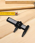 OHPHCALL 2pcs Wheel Hub Diameter Ruler ABS Measuring Tool for Automotive on wooden surface with measuring tape.