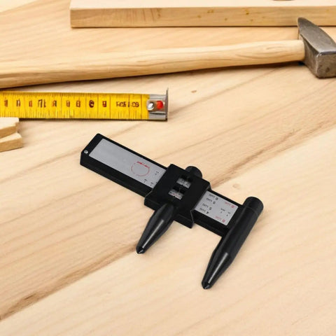 OHPHCALL 2pcs Wheel Hub Diameter Ruler ABS Measuring Tool for Automotive on wooden surface with measuring tape.