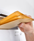 Person holding Beige Kraft Bubble Mailers With Self Seal Closure, Bubble Lined And Sturdy Padded Envelopes For Safe Shipping