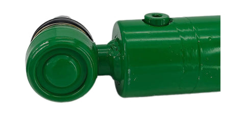 Close-up of a green power steering hydraulic cylinder for John Deere tractors and telehandlers, compatible with 4120 4320 4520 models.