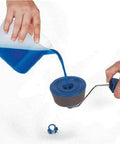 Top Shelf Paint Roller Brush Set With Slick Flocked Edger And No Mess Decorative Handle For Tight Corners and Pro Level Finishes Easy Peasy Diy Wall Decorating Kit pouring blue paint into roller.