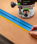 Low Profile Straight Edge Guide Rail Kit Extension Setup For Circular Saw Router And Jigsaw That Snaps Right On And Keeps Your Cuts Dead On Across Plywood And Solid Stock Wood with a router on wood surface.