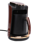Turkish Coffee Maker 250ml Electric Brewer 550W Fast Heating Single Cup Pot For Home Office Rich Flavor Brew Easy One Touch No Fuss Turkish Coffee Machine At Your Desk in black and brown, cord visible.