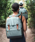 Person carrying Backpack Cooler For 18 Cans With Bottle Opener Leakproof Insulated Cooler Bag For Lunch At Work Beach Camping