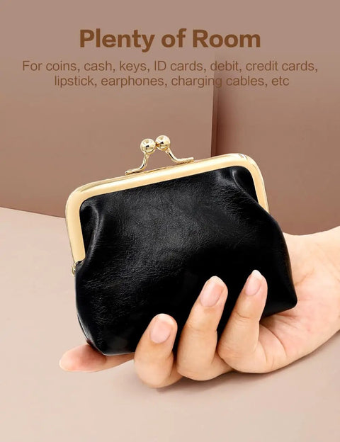 Totally Adorable Vintage Coin Purse For Women Super Chic Mini Leather Change Pouch With Secure Kiss Lock Clasp held in hand.
