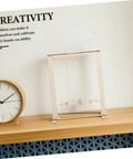 Educational Wooden Gravity Experiment Kit For Kids And Students on desk with clock, Interactive Maxwell Wheel Science Toy