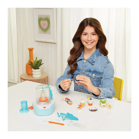 Smiling girl using Awesome Mini Pottery Studio Kit For Kids 8 And Up 26 Piece DIY Air Dry Clay Set for pottery projects at home