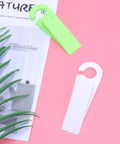 Set Of 6 Thermoplastic Rubber Door Stopper Wedges For Anti Slip Protection And Finger Pinch Prevention on pink surface