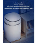 Compact Portable Washing Machine With Integrated Drying Bucket And Quick Drain Hose 3.8 Kilogram Capacity Mini Clothes Washer next to a wooden shelf