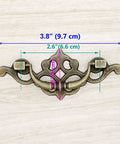 Vintage Antique Brass Bail Pull Handles Set For Wooden Drawers Cabinets And Cupboards Four Pack With Distressed Zinc Alloy Finish And Anti Rust Durability detailing 3.8 inch length, 1.6 inch height, 2.6 inch spacing with measurements displayed.