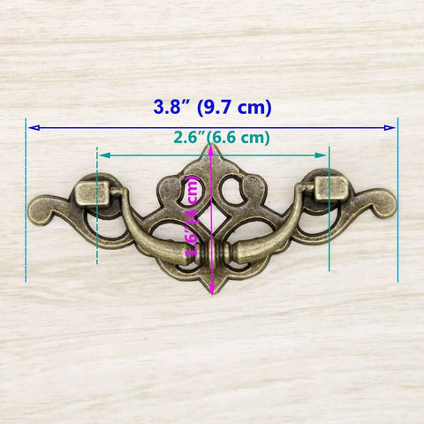 Vintage Antique Brass Bail Pull Handles Set For Wooden Drawers Cabinets And Cupboards Four Pack With Distressed Zinc Alloy Finish And Anti Rust Durability detailing 3.8 inch length, 1.6 inch height, 2.6 inch spacing with measurements displayed.